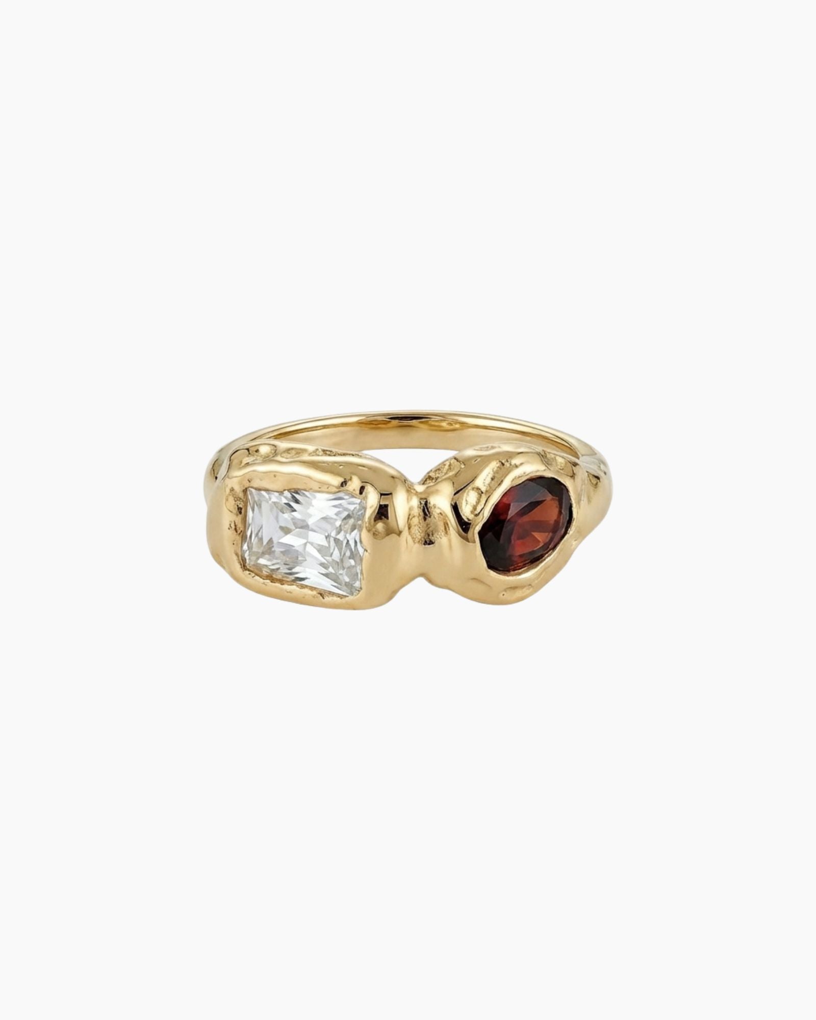 Solid gold sculptural ring featuring a clear rectangular stone and a round deep brown gemstone set in an organic molten-style band. Designed for women seeking a modern statement ring that balances structure and softness, ideal for everyday wear or special occasions and for those wanting a distinctive alternative to traditional gemstone rings.