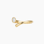 Product photo of the Celine gold open-band ring featuring a curved stainless steel base, 18k gold PVD finish and oval white cubic zirconia stone on a white background. Designed for women looking for durable, low-maintenance gold jewellery, this ring helps add an elegant statement to daily styling.