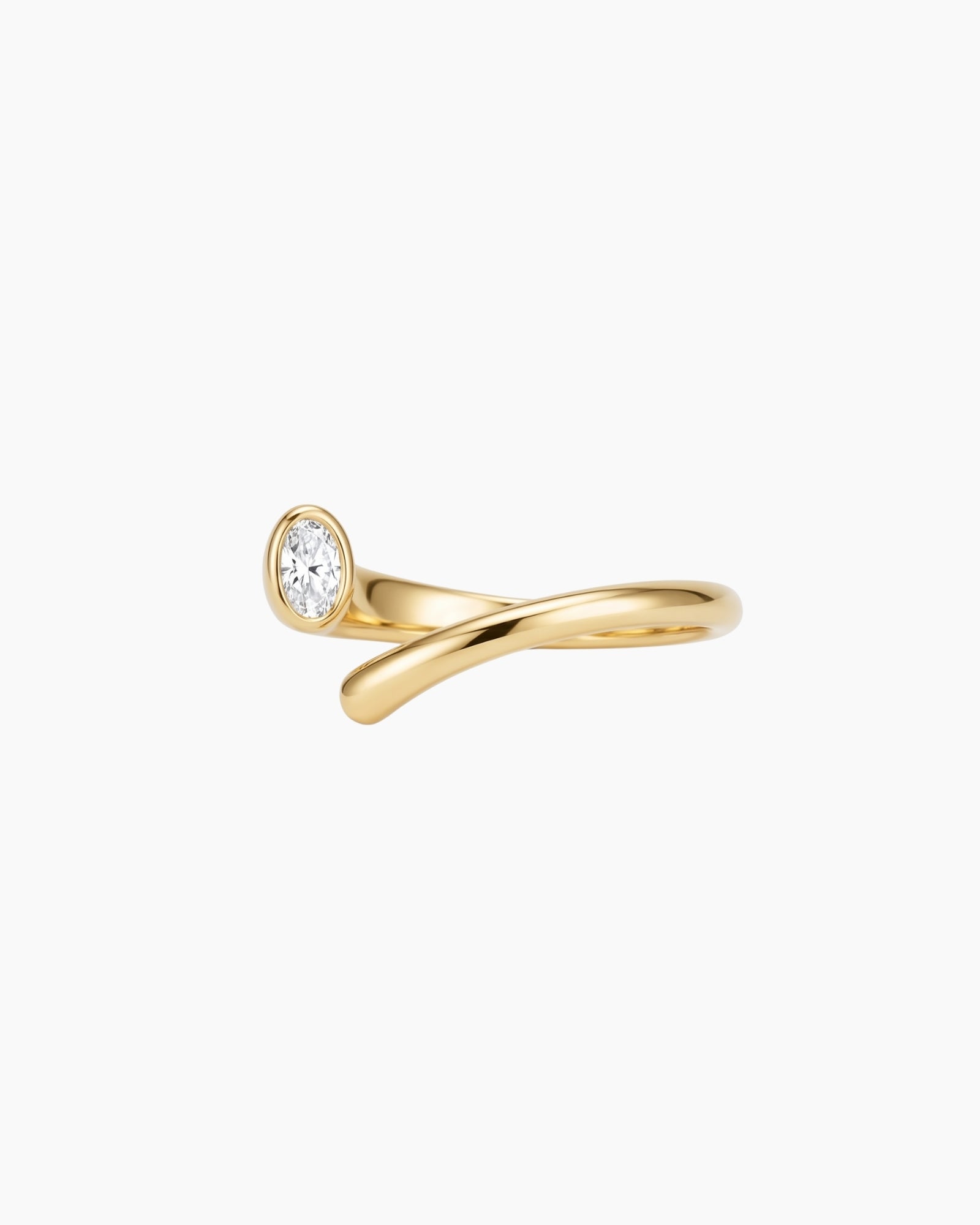 Product photo of the Celine gold open-band ring featuring a curved stainless steel base, 18k gold PVD finish and oval white cubic zirconia stone on a white background. Designed for women looking for durable, low-maintenance gold jewellery, this ring helps add an elegant statement to daily styling.