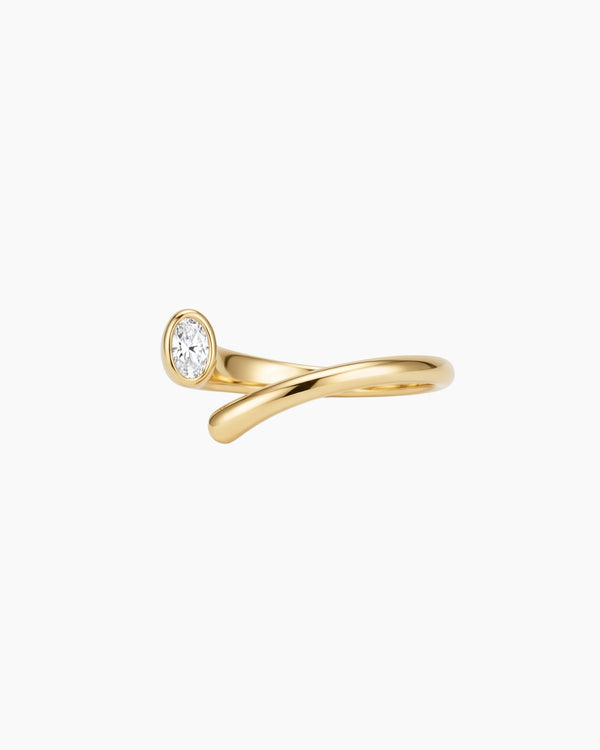 Product photo of the Celine gold open-band ring featuring a curved stainless steel base, 18k gold PVD finish and oval white cubic zirconia stone on a white background. Designed for women looking for durable, low-maintenance gold jewellery, this ring helps add an elegant statement to daily styling.