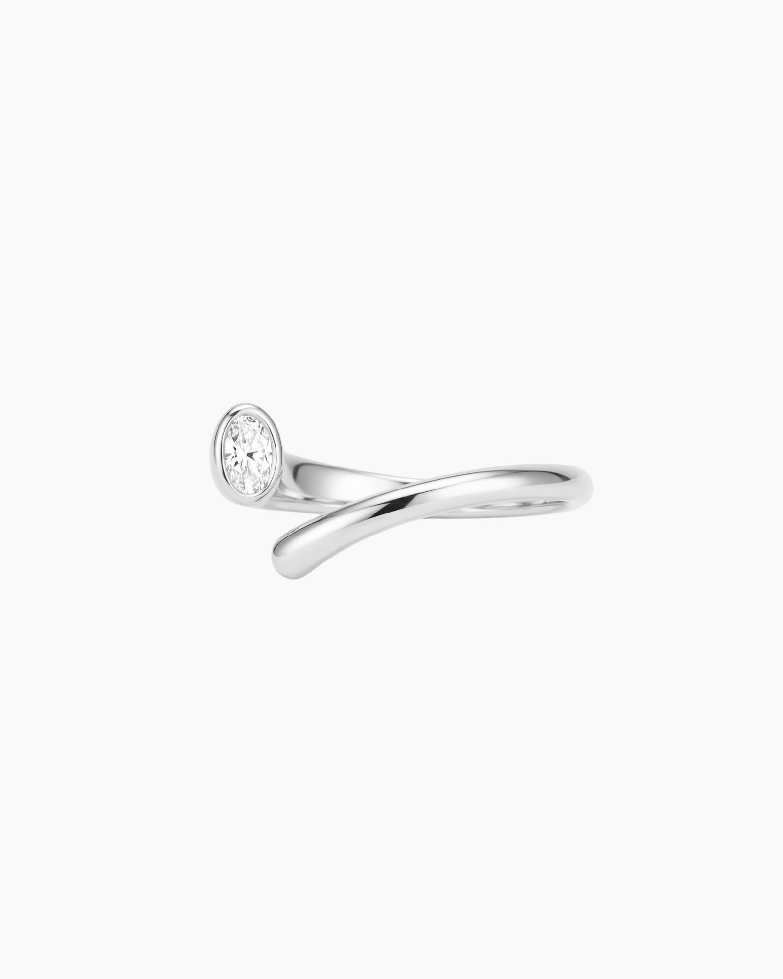 Product photo of the Celine silver open-band ring with a polished stainless steel base and oval white cubic zirconia stone on a white background. Ideal for women who want timeless silver jewellery, this ring helps elevate everyday outfits with a clean, modern and minimal sparkle.