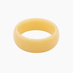 Chunky butter yellow resin bangle with a glossy polished finish. The Lumi Resin Bangle is a modern statement bracelet designed for effortless everyday styling, capsule wardrobes, minimal fashion, and elevated neutral outfits.