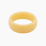 Chunky butter yellow resin bangle with a glossy polished finish. The Lumi Resin Bangle is a modern statement bracelet designed for effortless everyday styling, capsule wardrobes, minimal fashion, and elevated neutral outfits.