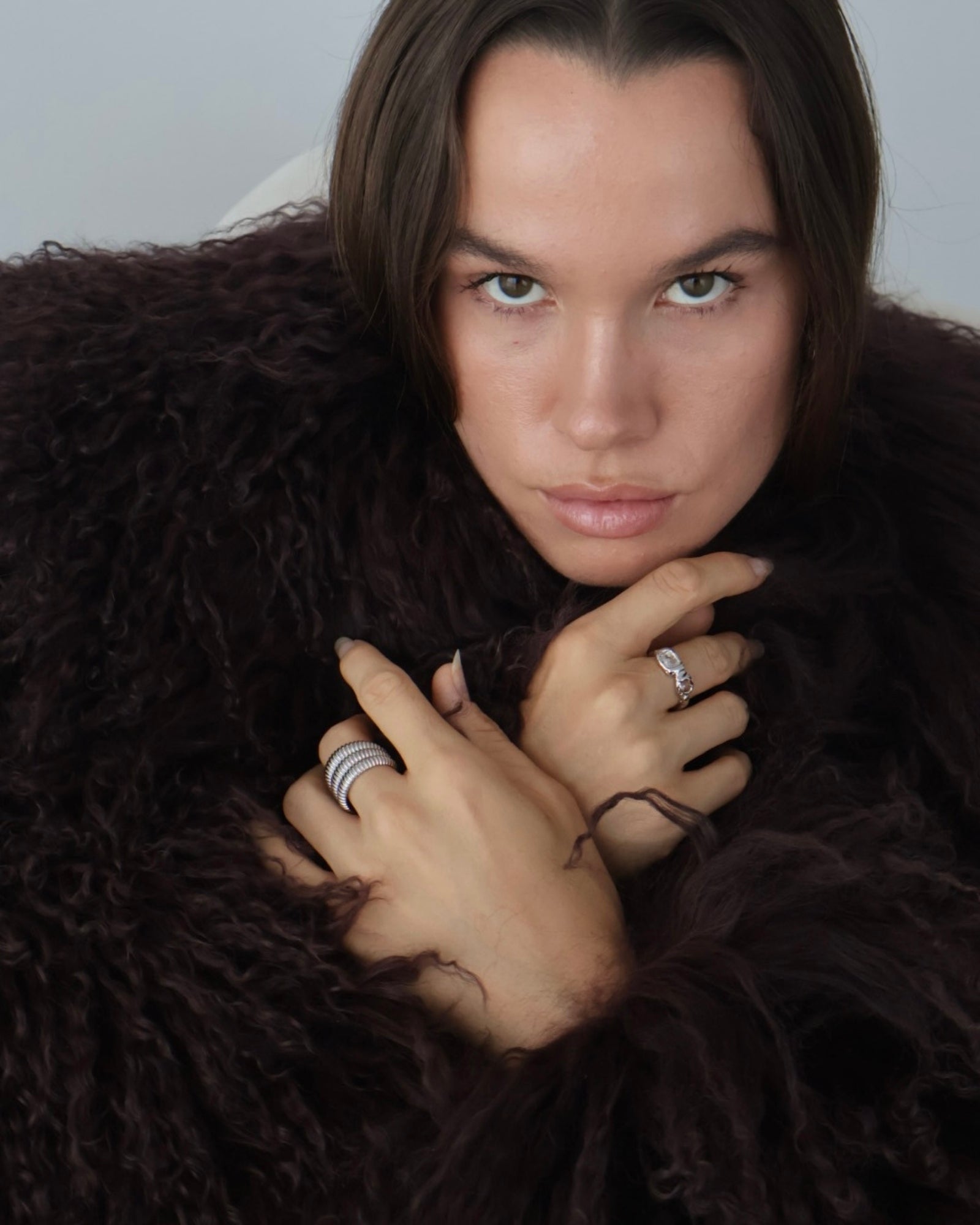 Model wearing the Dara silver ribbed statement ring with elevated everyday jewellery styling, ideal for customers looking for inspiration on how to wear a bold stainless steel ring with a polished outfit.