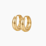 SELENE rounded gold hoop earrings on a white background. Classic chunky hoop earrings crafted from sterling silver with micron 18k gold plating, designed for lightweight everyday wear, minimal jewellery styling and timeless layered looks.