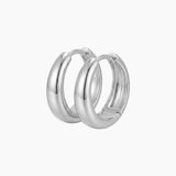SELENE rounded silver hoop earrings on a white background with a polished chunky dome design. Sterling silver hoop earrings with rhodium plating, designed for comfortable everyday wear, sensitive ears, minimalist styling and classic layered jewellery looks.