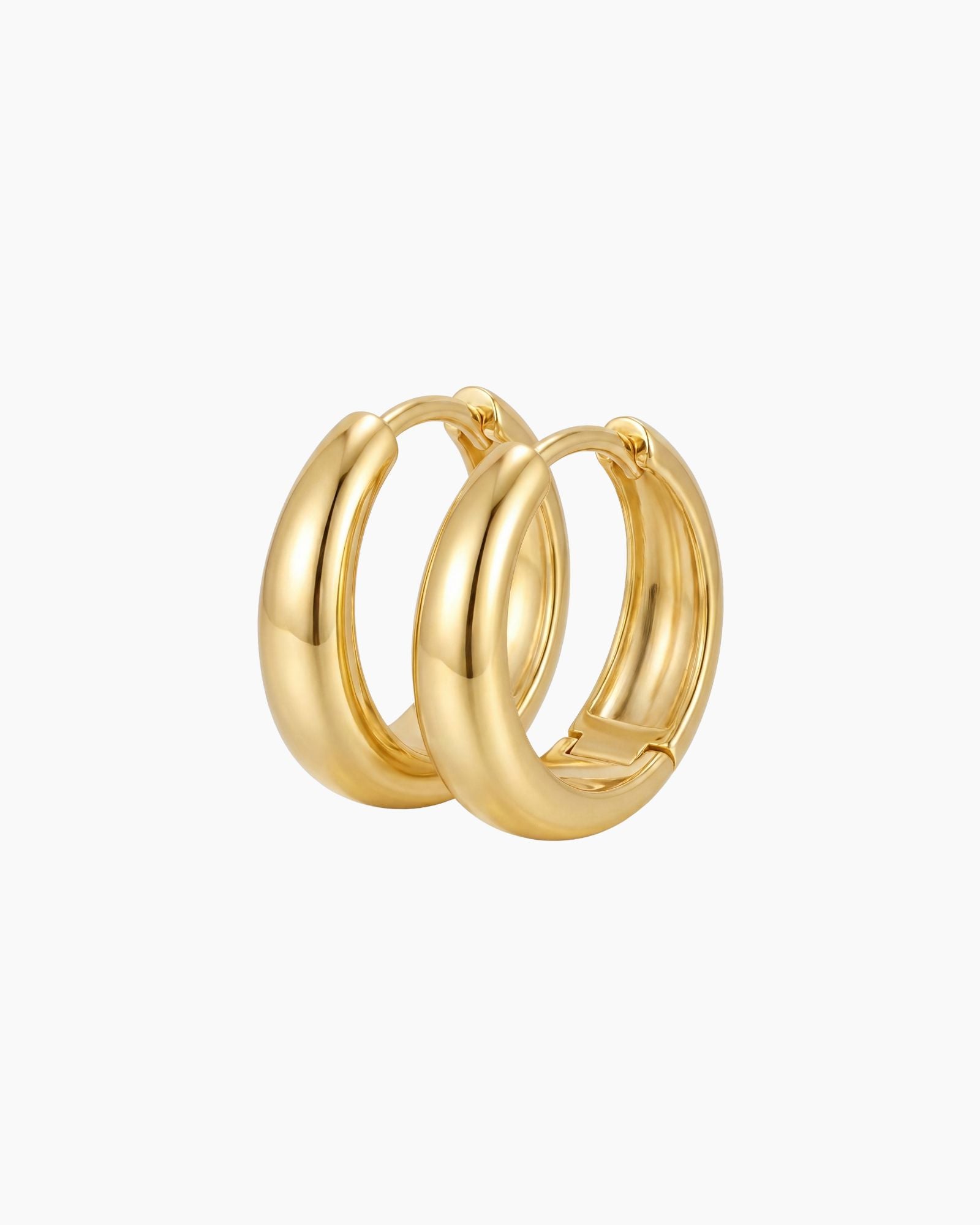 SELENE rounded gold hoop earrings on a white background featuring a polished chunky dome design. Sterling silver hoop earrings with micron 18k gold plating, ideal for everyday wear, sensitive ears, minimal jewellery styling and timeless layered looks.