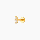 A single gold-plated flat back stud earrings with clear crystal embellishments designed for cartilage piercings.