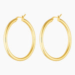 Studio product image of Aria large gold hoop earrings shown as a matching pair on a white background. Lightweight 40mm hollow gold hoops with a smooth polished finish, designed for everyday wear and sensitive ears, offering bold impact without heaviness.