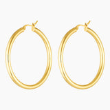 Studio product image of Aria large gold hoop earrings shown as a matching pair on a white background. Lightweight 40mm hollow gold hoops with a smooth polished finish, designed for everyday wear and sensitive ears, offering bold impact without heaviness.