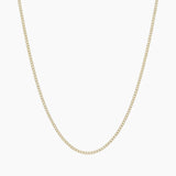 Dainty gold filled curb chain necklace by House of Slani displayed on a white background, featuring fine polished links designed for layering or adding charms.