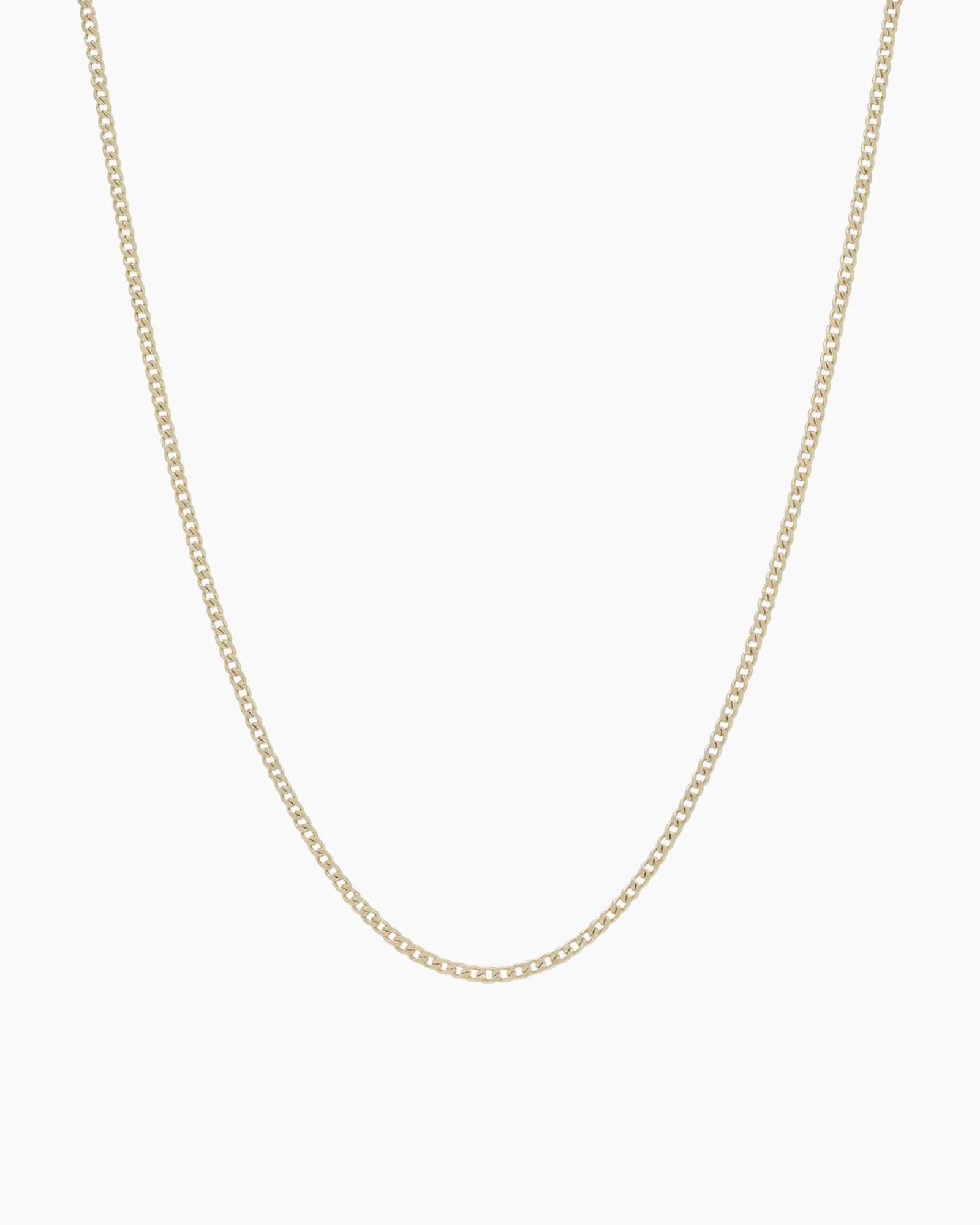 Dainty gold filled curb chain necklace by House of Slani displayed on a white background, featuring fine polished links designed for layering or adding charms.