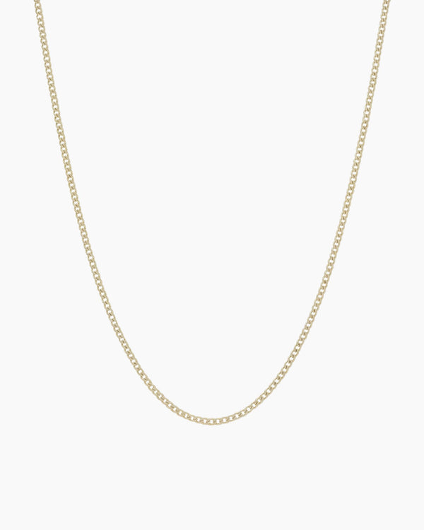 Dainty gold filled curb chain necklace by House of Slani displayed on a white background, featuring fine polished links designed for layering or adding charms.