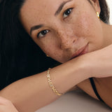Gold textured chain bracelet worn on a woman’s wrist, styled on a model to show fit and scale, designed for women looking for a timeless, high-quality everyday bracelet that elevates simple outfits and layers effortlessly with other jewellery.