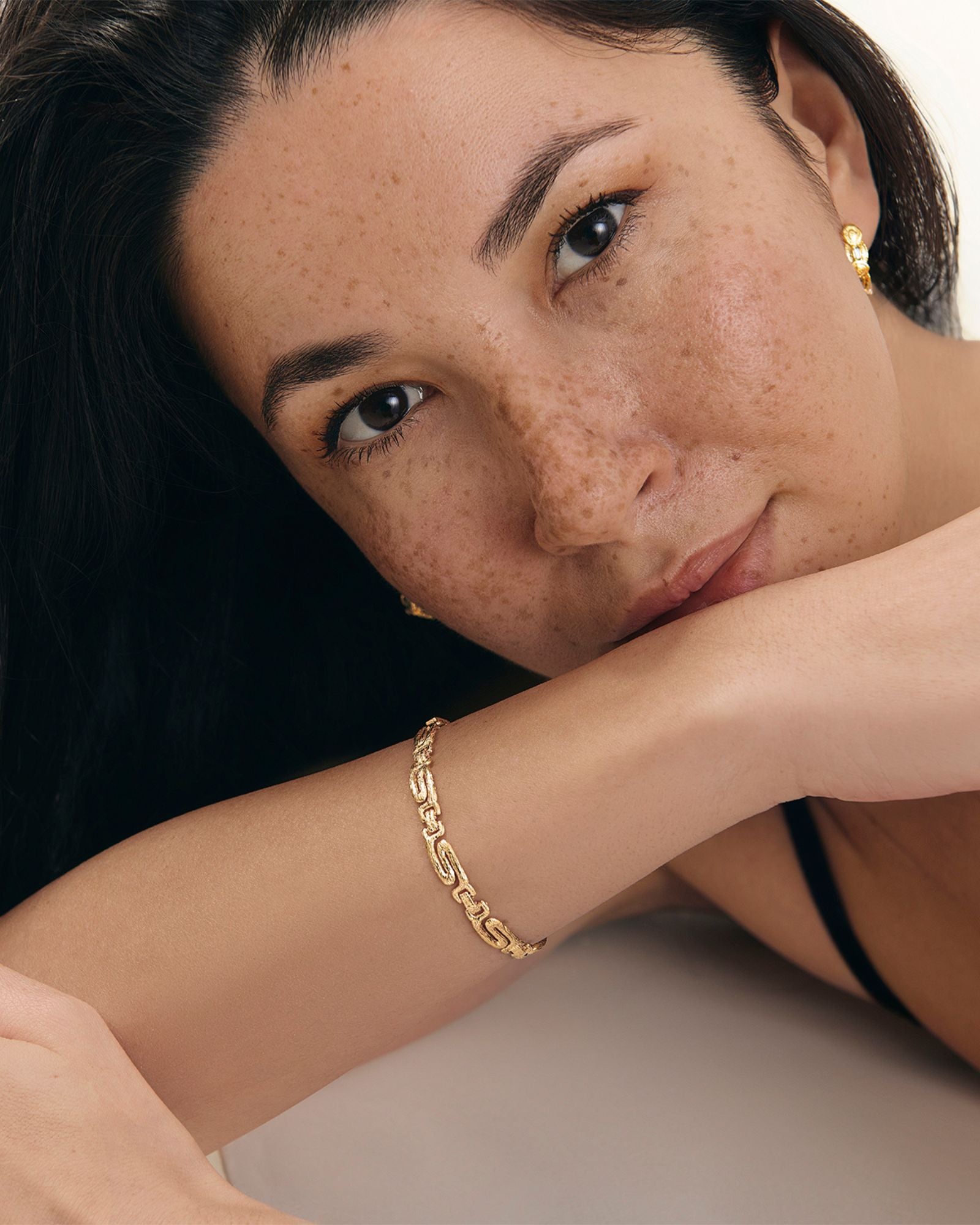 Gold textured chain bracelet worn on a woman’s wrist, styled on a model to show fit and scale, designed for women looking for a timeless, high-quality everyday bracelet that elevates simple outfits and layers effortlessly with other jewellery.