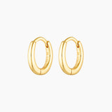 Product image of a pair of small gold huggie hoop earrings with a softly oval shape and a smooth polished finish, crafted from sterling silver with 18k gold plating. Shown on a clean white background, these minimalist gold hoops are designed for women seeking everyday hoop earrings that are lightweight, comfortable, and suitable for sensitive ears, offering a versatile solution for daily wear, ear stacking, and a refined, timeless jewellery look.