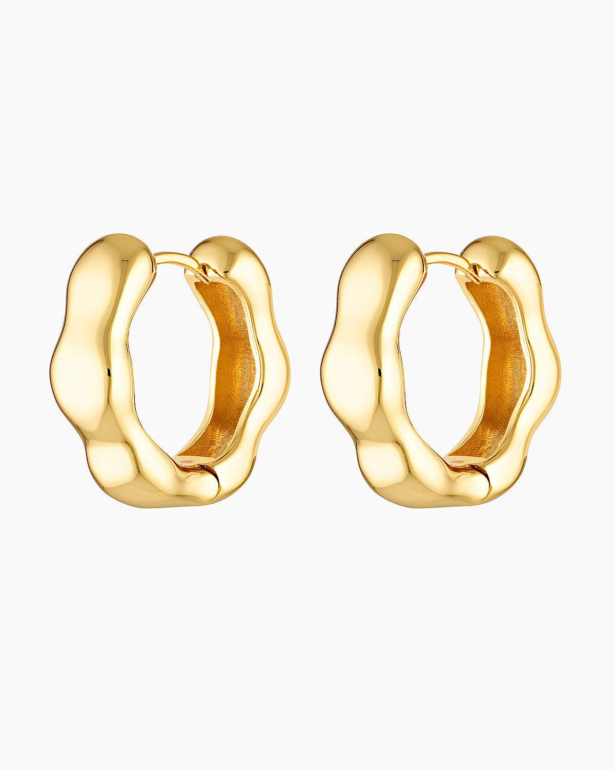 Close-up product image of Bella gold hoop earrings on a white background, featuring a sculpted organic shape with a polished finish. This image is for women looking for elevated gold hoop earrings that add interest to a minimal outfit and offer a refined alternative to classic smooth hoops for everyday wear.