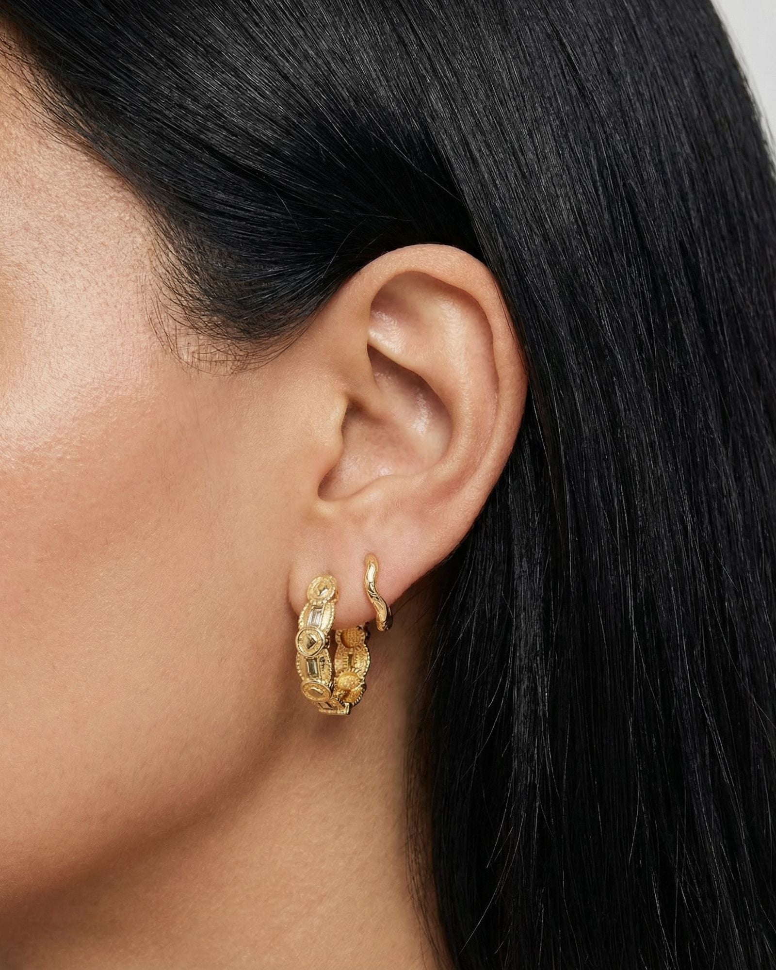 euro summer vintage inspired medium sized hoops with different gemstones like peridot green, canary yellow and white, dainty wavy textured huggie hoops with a small dainty white square cut gemstone in long lasting 18k gold