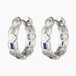 A pair of medium-sized hoop earrings with cubic zirconia, available in gold and rhodium colors.