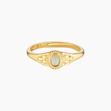 Front-facing product photo of the Eleni gold ring made from 14K gold-filled brass, featuring a slim polished band with an oval central detail and subtle textured accents on each side, shown on a clean white background. Designed for women seeking a minimalist gold ring for everyday wear, stacking, or gifting, offering a refined, lightweight alternative to bulky statement rings while maintaining an elegant, timeless look.