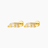 Pair of gold flat back stud earrings featuring three round cubic zirconia stones in a minimalist cluster design, shown on a white background. Designed for people with cartilage, helix or lobe piercings who want comfortable, hypoallergenic flat back earrings that sit flush to the ear and are suitable for everyday wear, sleeping, and sensitive ears.