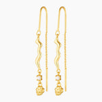 thread gold earring with organic charm with attached white gem stone and a gold nugget