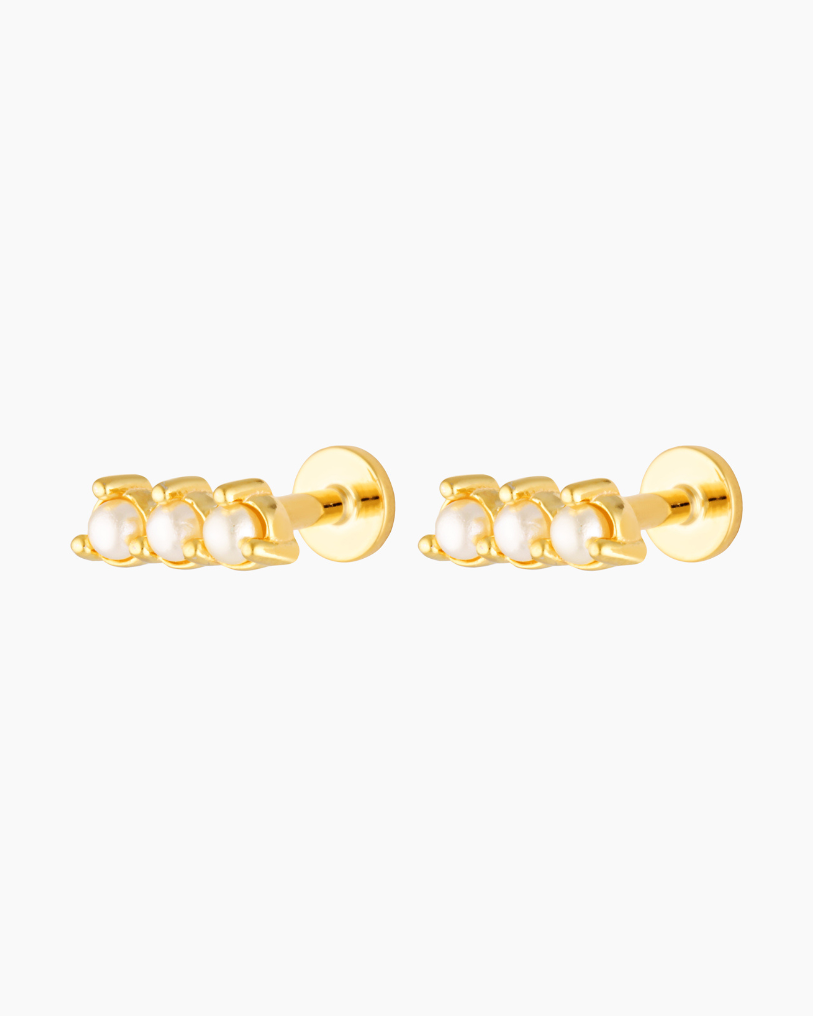 Pair of gold flat back stud earrings featuring three petite freshwater pearls set in a straight bar design with a screw-in backing. Designed for women seeking comfortable, secure flat back earrings for sensitive ears, everyday wear, and cartilage or lobe piercings, offering a polished bridal and minimalist jewellery option suitable for all-day and overnight wear.