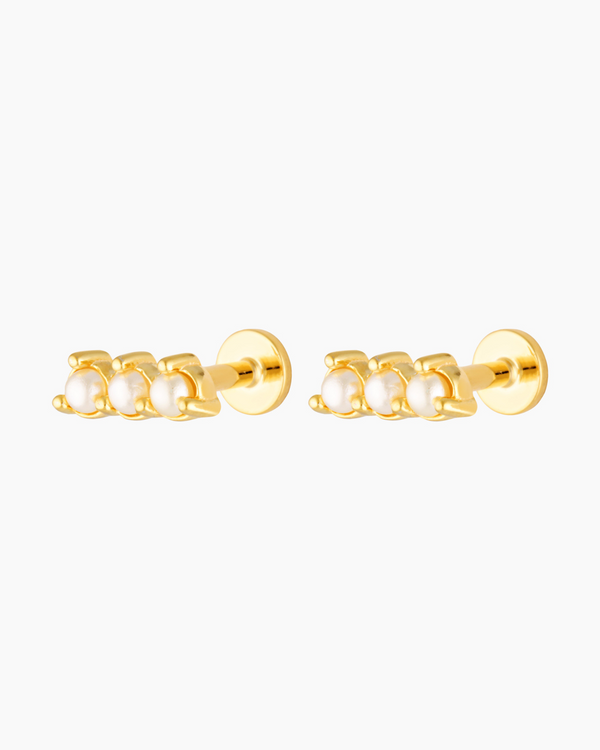 Pair of gold flat back stud earrings featuring three petite freshwater pearls set in a straight bar design with a screw-in backing. Designed for women seeking comfortable, secure flat back earrings for sensitive ears, everyday wear, and cartilage or lobe piercings, offering a polished bridal and minimalist jewellery option suitable for all-day and overnight wear.
