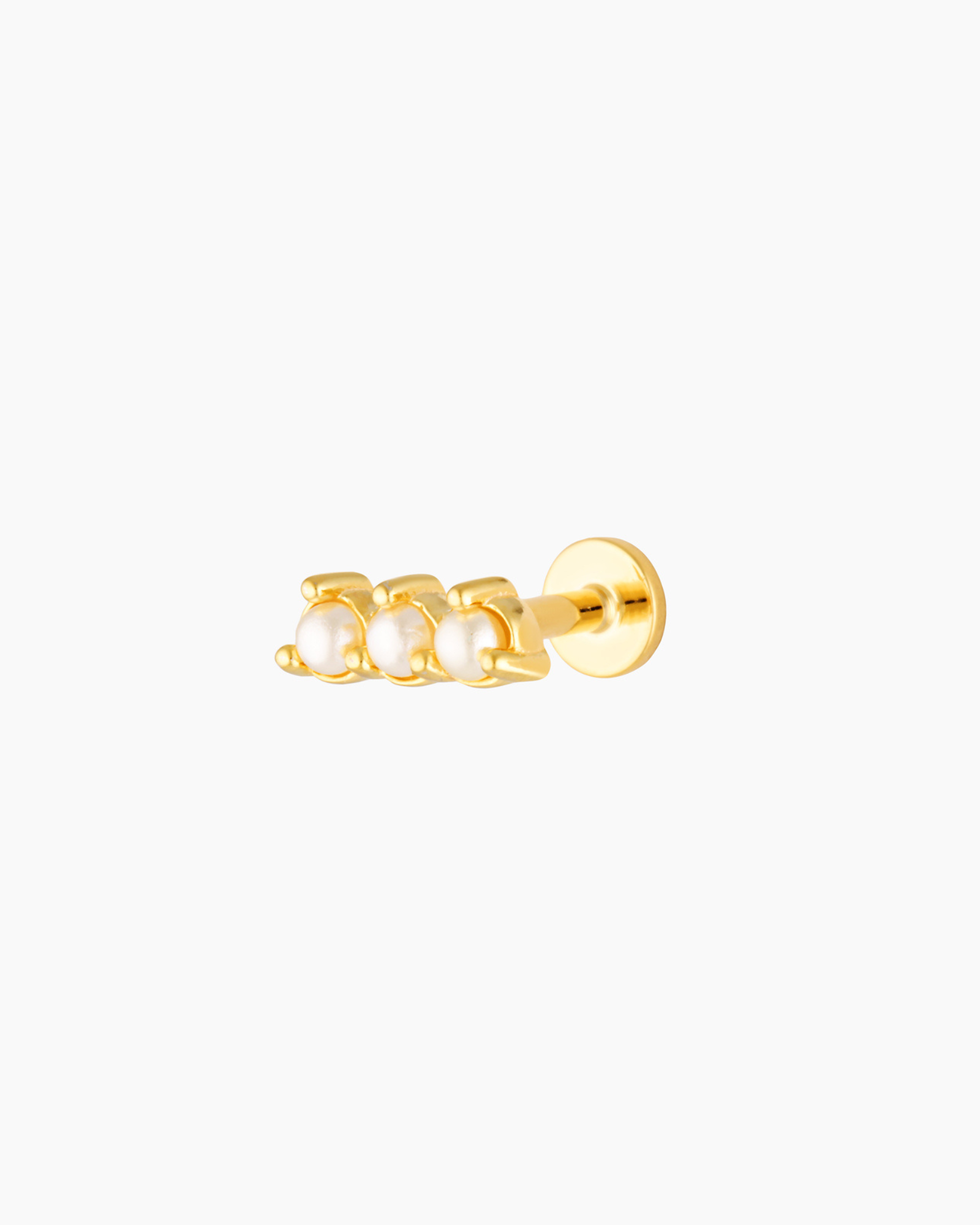 Product image of a single gold flat back stud earring with three freshwater pearls arranged in a horizontal bar and a smooth screw-in flat back post, shown on a white background. Designed for women seeking comfortable flat back ear piercings for sensitive ears, this pearl bar stud provides a secure, low-profile option for cartilage, helix, tragus, conch, or lobe piercings, ideal for everyday wear, bridal jewellery, and long-lasting comfort.