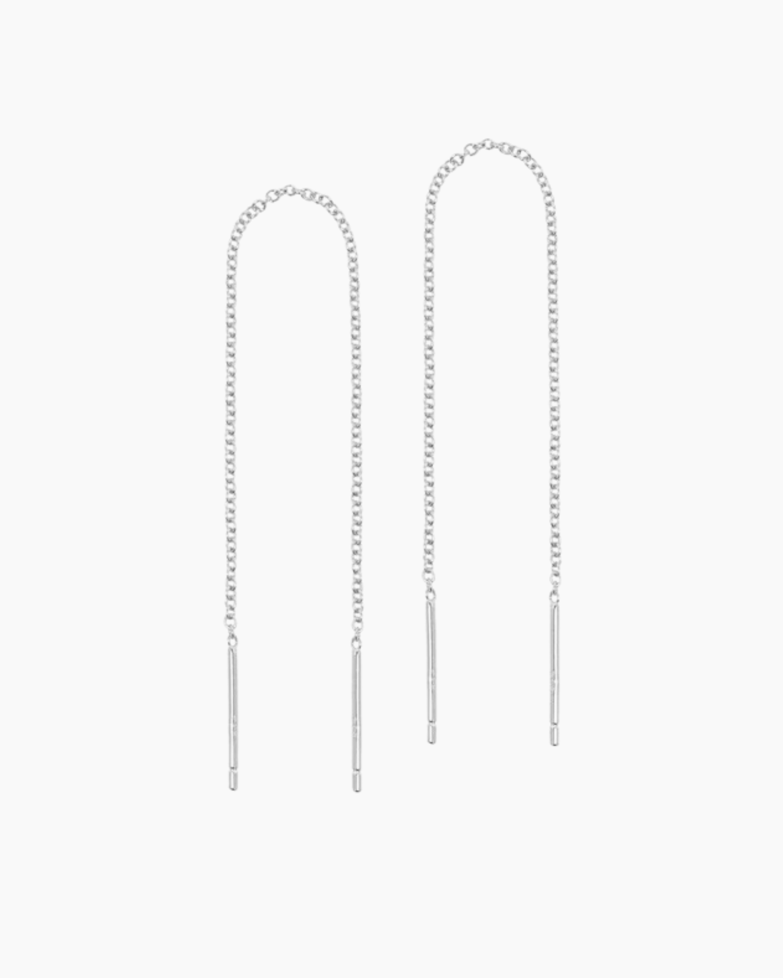 Product photo of a pair of silver threader earrings displayed on a white background, featuring fine rolo chain strands with slim straight bar ends designed to thread through the ear. This image is for people looking for minimalist silver thread earrings, long drop earrings, or hypoallergenic silver jewellery, showing a lightweight solution for effortless ear stacking, subtle movement, and elegant everyday or evening styling without bulk.