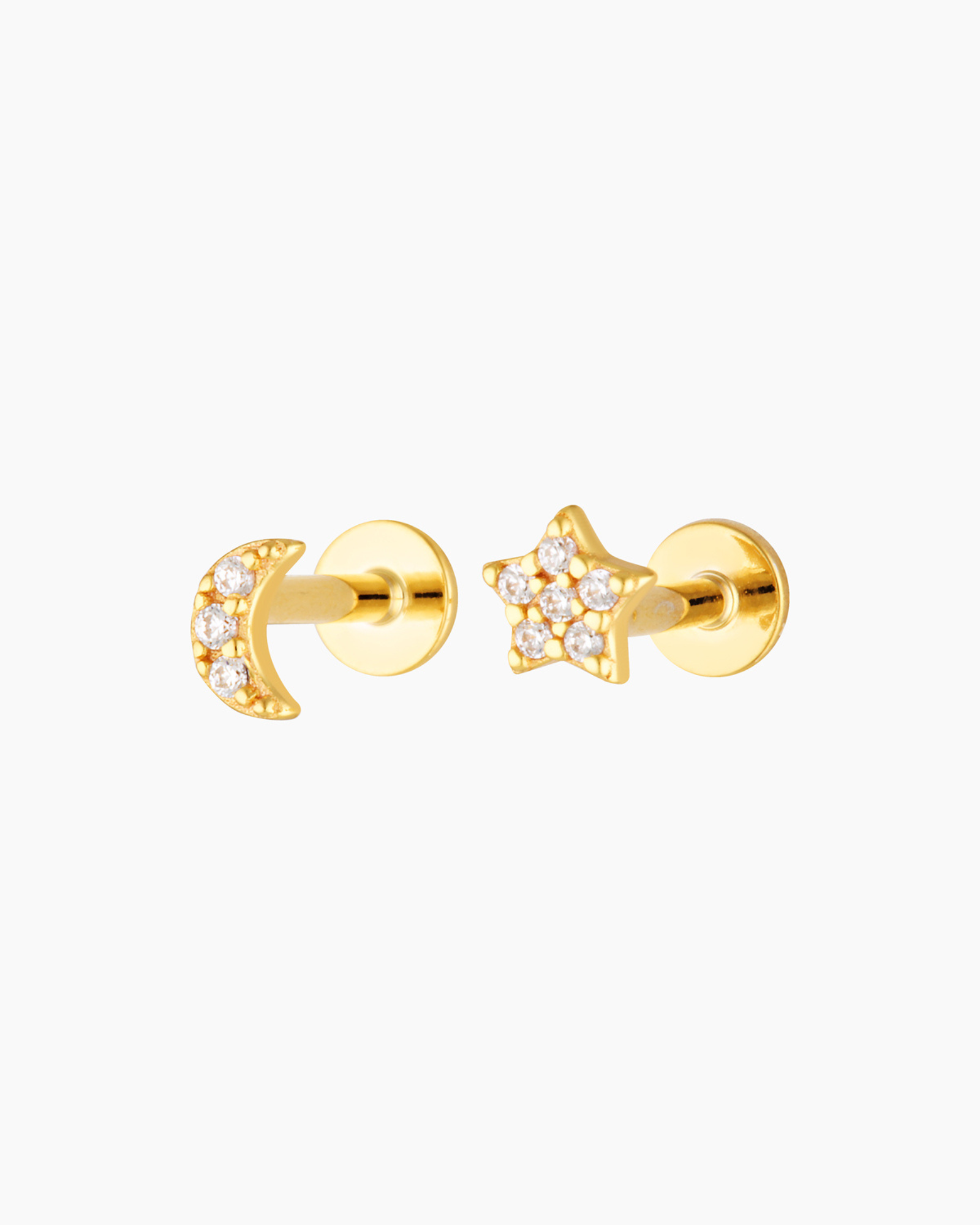 Pair of gold moon and star flat back stud earrings with clear crystal detailing, shown on a white background. Designed for people with cartilage or lobe piercings who want comfortable, hypoallergenic flat back earrings that sit securely for everyday wear and sensitive ears.