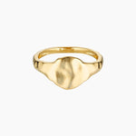 Product image of a flat organic gold signet ring with a softly sculpted face, shown on a white background. Designed for women seeking a minimalist gold signet ring for everyday wear, this image highlights a modern statement ring that offers a refined alternative to traditional signet styles and is easy to style daily.