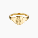 Product image of a flat organic gold signet ring with a softly sculpted face, shown on a white background. Designed for women seeking a minimalist gold signet ring for everyday wear, this image highlights a modern statement ring that offers a refined alternative to traditional signet styles and is easy to style daily.