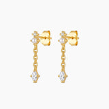 18K gold plated pearl drop earrings featuring a marquise-cut cubic zirconia stone suspended from a fine chain. Feminine lightweight gold earrings for women looking for timeless everyday jewellery, bridal earrings, special occasion accessories or elegant gold pearl earrings.