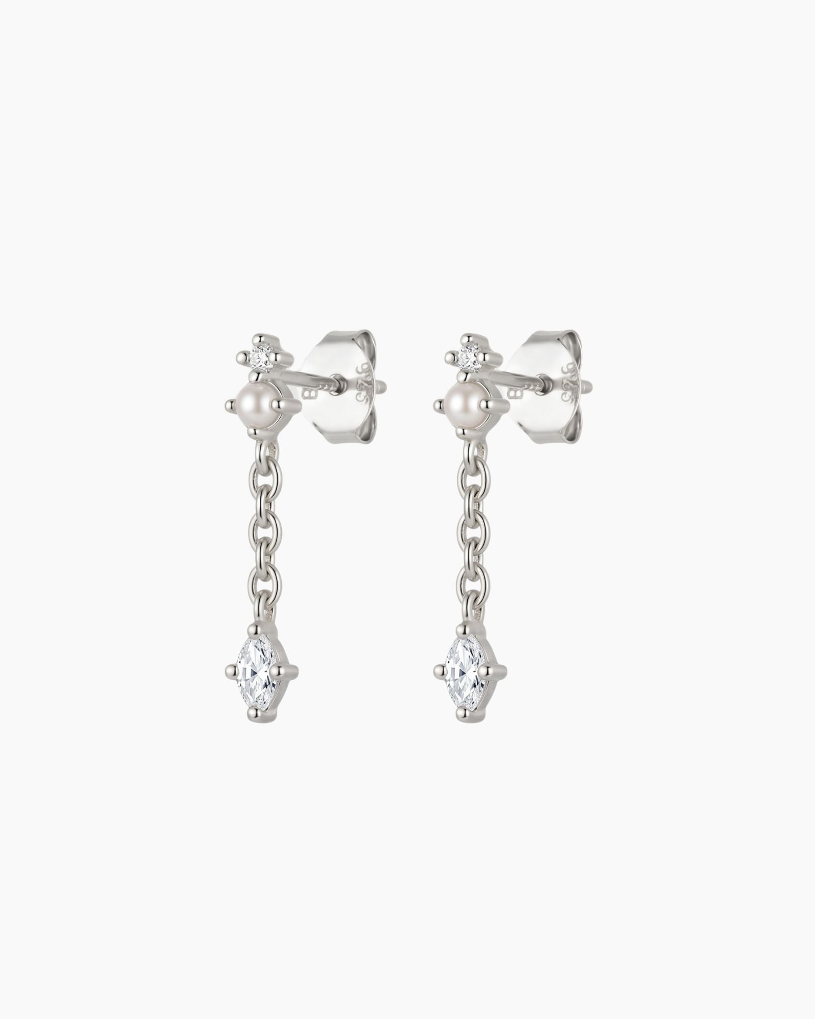 Sterling silver pearl drop earrings with a marquise-cut cubic zirconia pendant and delicate chain detail on a light grey background. Lightweight dainty earrings designed for women seeking elegant everyday jewellery, bridal accessories, wedding guest jewellery or minimalist sterling silver earrings.
