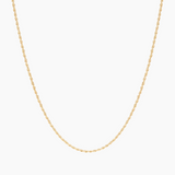 Gold rope chain necklace photographed flat on a white background, showing a slim twisted rope design in 18k gold-filled material. Designed for women and men seeking a lightweight everyday gold necklace that layers easily with pendants or longer chains, adding subtle texture and shine without bulk. Ideal for minimalist styling, necklace stacking, and daily wear, including water- and shower-safe use.