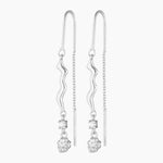 thread silver earring with organic charm with attached white gem stone and a silver nugget