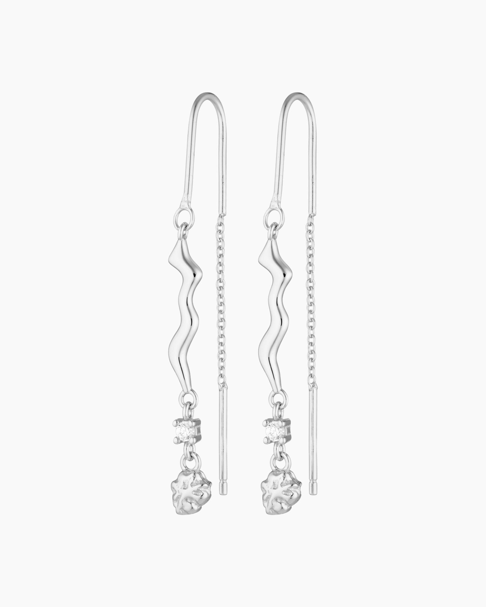 thread silver earring with organic charm with attached white gem stone and a silver nugget