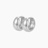 SELENE rounded silver hoop earrings on a white background featuring a polished chunky dome design. Sterling silver hoop earrings with rhodium plating, designed for lightweight everyday wear, sensitive ears, minimal jewellery styling and timeless layered looks.