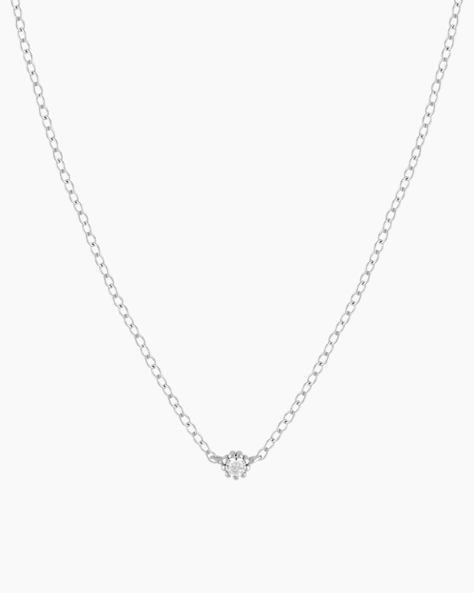 Silver Sofia Necklace featuring a dainty cubic zirconia pendant on a thin rolo chain.