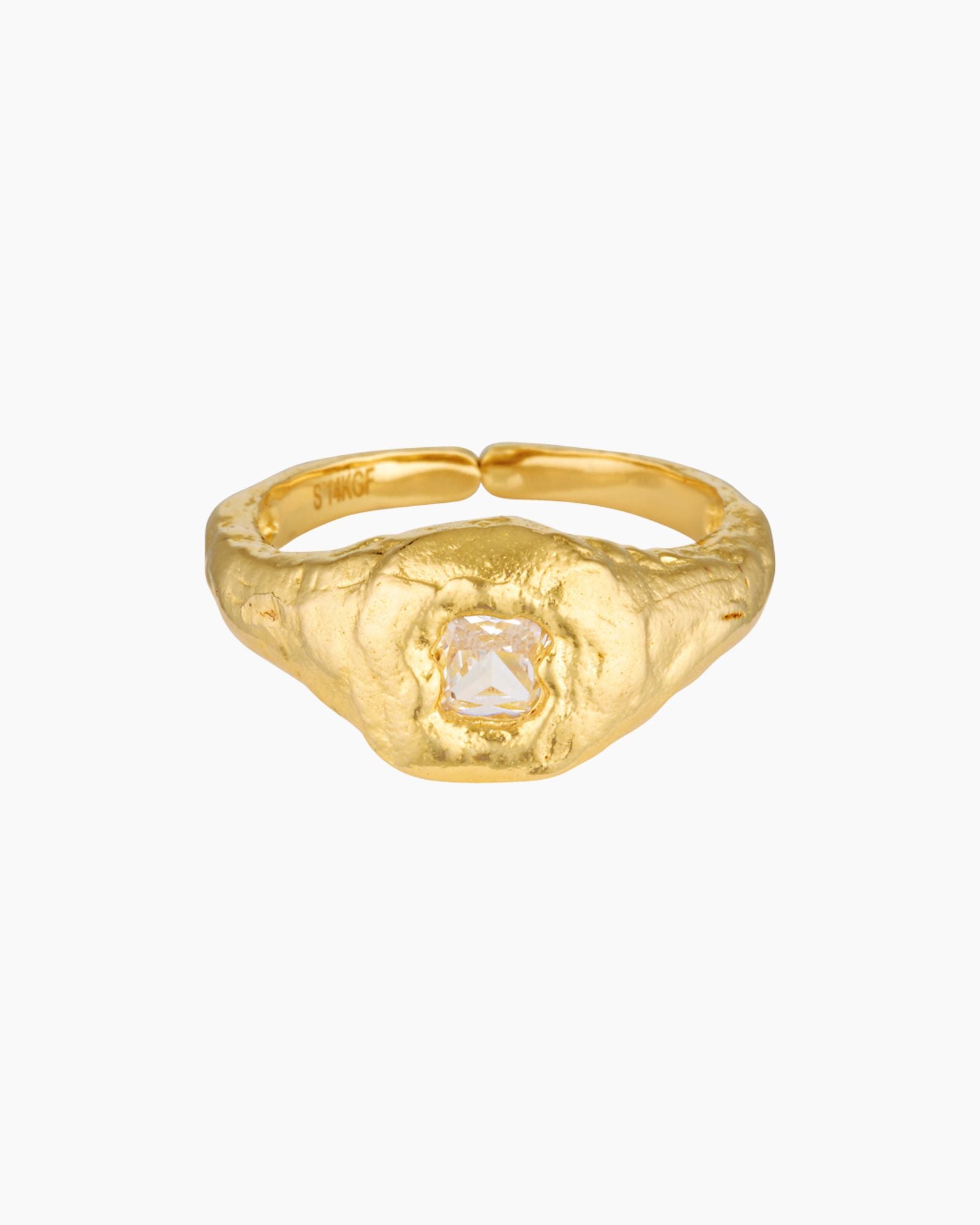Close-up product image of a gold filled ring featuring a textured organic band with a central clear crystal set in a raised bezel on a white background. This image is for women looking for an everyday gold ring that adds subtle statement detail and offers a refined alternative to smooth minimalist bands.