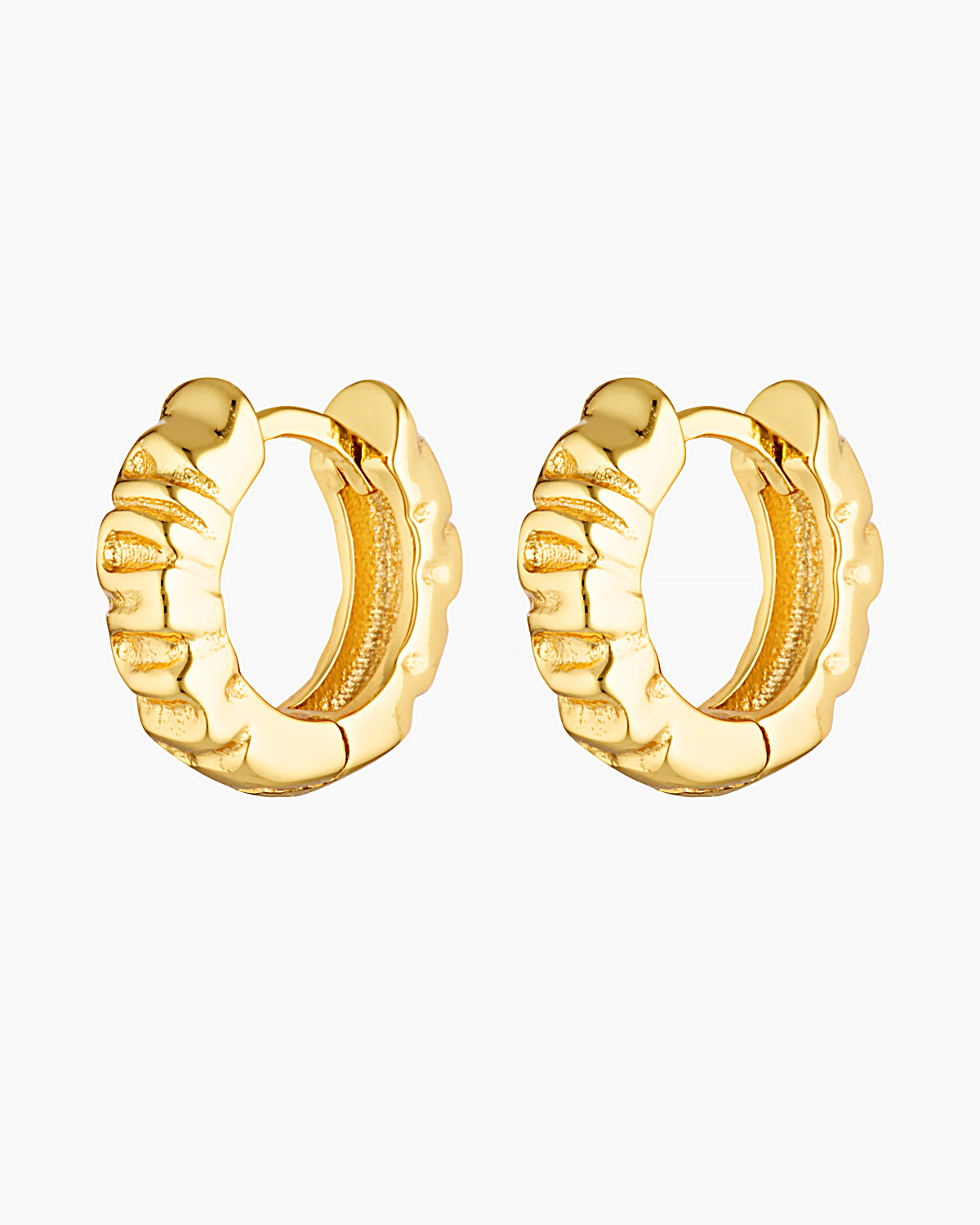 Pair of Xanthe textured gold huggie hoop earrings on a white background, featuring a sculptural rippled wave design. Designed for women seeking small gold hoop earrings that add subtle statement and texture to everyday styling, ear stacks, and huggie piercings. Ideal for those looking for lightweight, vintage-inspired gold hoops with a refined finish for daily wear.