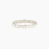 Minimalist freshwater pearl ring band made with natural white pearls arranged in a continuous circle on a clean white background. Designed for women seeking a lightweight, elegant pearl ring for everyday wear that offers a timeless, comfortable alternative to traditional metal rings.