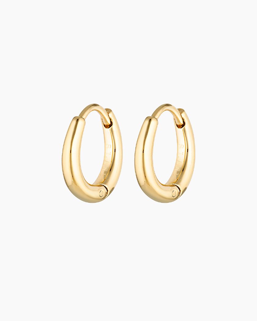 Elevate your style with our Ava Hoops. Perfect for everyday wear or layering. Water and shower safe. Sterling silver base with 18K micron plating. Shop now for timeless elegance!