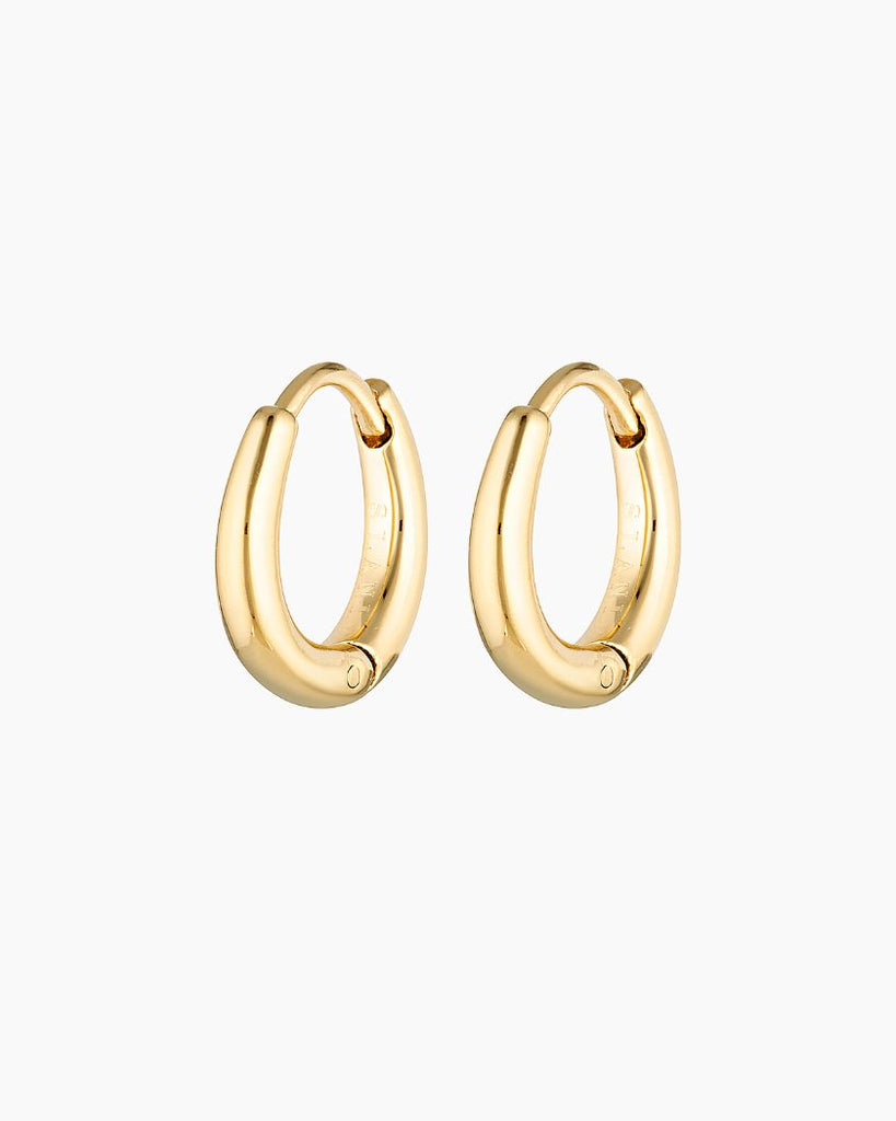 Elevate your style with our Ava Hoops. Perfect for everyday wear or layering. Water and shower safe. Sterling silver base with 18K micron plating. Shop now for timeless elegance!