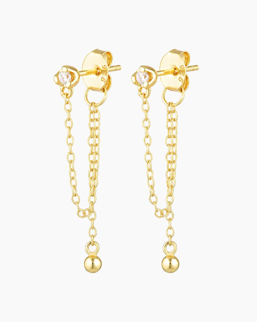 Elevate your style with our Alune Studs. Featuring a delicate gold chain for an elegant waterfall effect. Wear alone for a classic look or pair with our Aria Hoops for a statement set. Shop now!