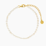 Minimalist freshwater pearl bracelet with natural white pearls, a gold-tone lobster clasp, and an adjustable extension chain on a clean white background. Designed for women seeking an elegant everyday pearl bracelet that is comfortable, adjustable, sensitive-skin friendly, and suitable for daily wear.
