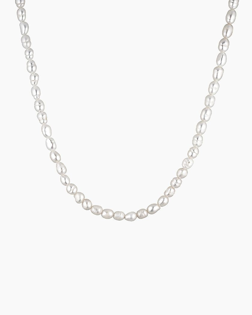 Dainty freshwater pearl necklace featuring small 3–4mm natural white pearls strung in a delicate, evenly spaced design on a fine strand. Designed for women seeking a minimalist pearl necklace for everyday wear, layering, and timeless styling without an oversized or heavy look.