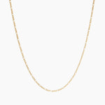 Minimal 18K gold-filled chain necklace photographed on a clean white background, featuring a fine elongated link design. Ideal for women seeking an everyday gold necklace for layering or wearing alone, offering a timeless, lightweight solution for effortless minimalist styling and water-safe daily wear.
