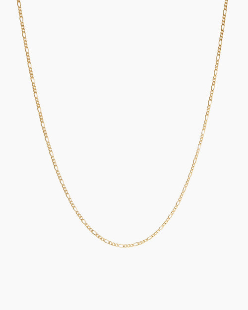 Minimal 18K gold-filled chain necklace photographed on a clean white background, featuring a fine elongated link design. Ideal for women seeking an everyday gold necklace for layering or wearing alone, offering a timeless, lightweight solution for effortless minimalist styling and water-safe daily wear.
